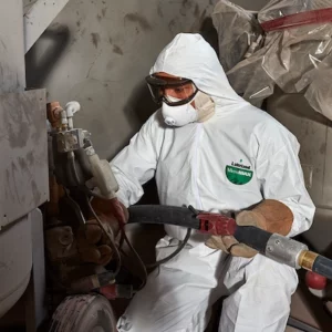 MicroMax protecting industrial worker painting with liquid spray paint